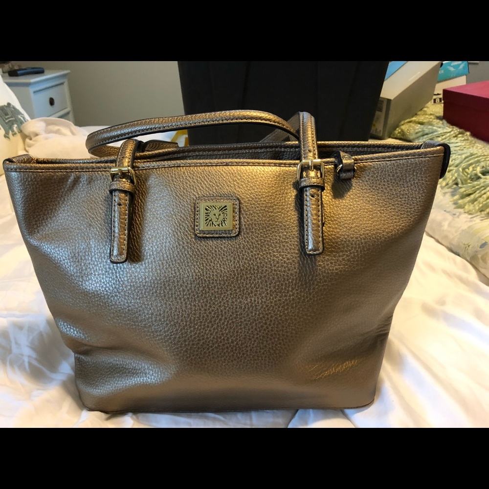 AK never used bronze purse